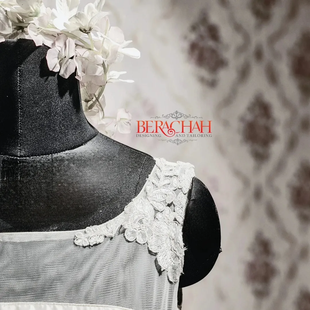 Close-up of hand-stitched lace on a bridal bodice