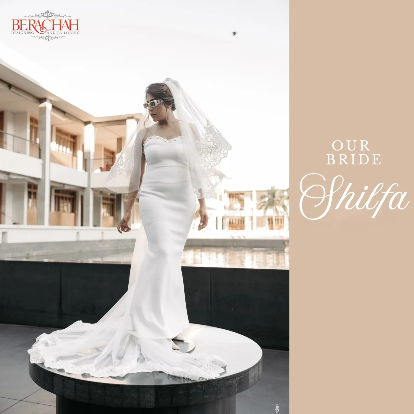 Bride in a sleek white satin mermaid gown with long train