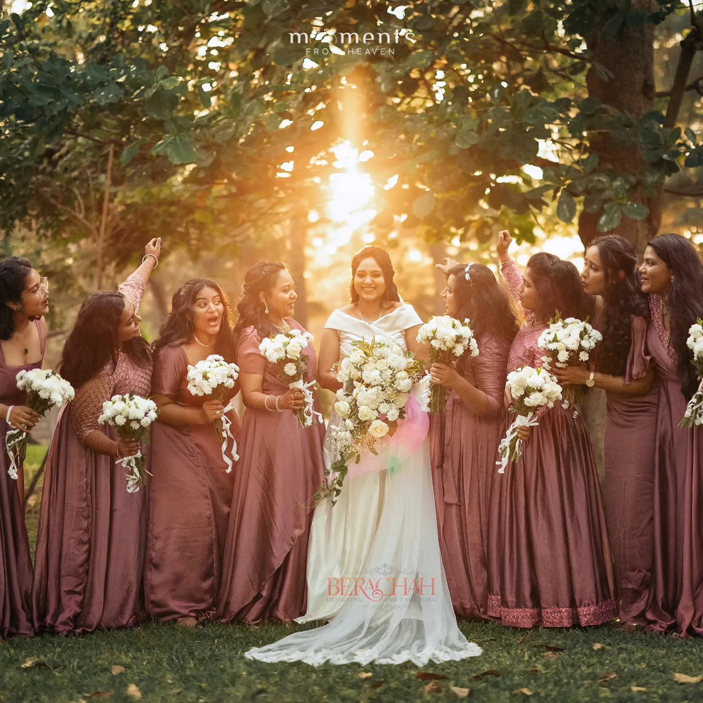 Bride with bridesmaids in rose satin under a golden sunset
